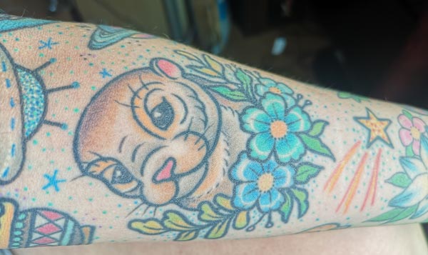 Holly's aged otter tattoo