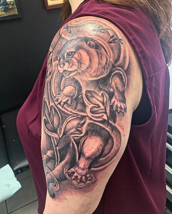Otter-swimming-in-leaves-right Otter swimming in leaves tattoo left