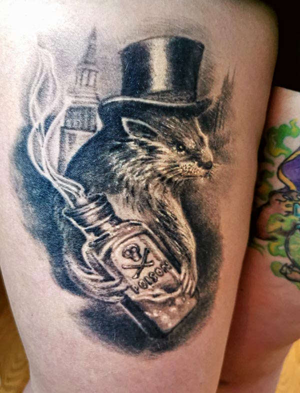 Otter-with-poison-bottle-left-leg-tattoo Otter with poison bottle left leg tattoo