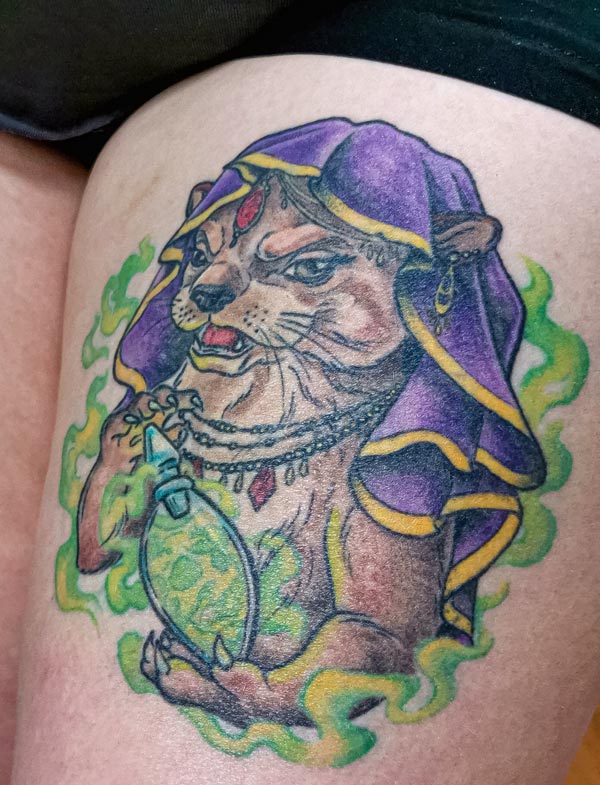 Otter-with-poison-bottle-right-leg-tattoo Otter with poison bottle right leg tattoo
