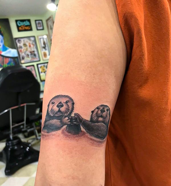 Sea otters holding hands tattoo