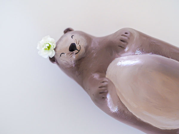 Painted clay otter